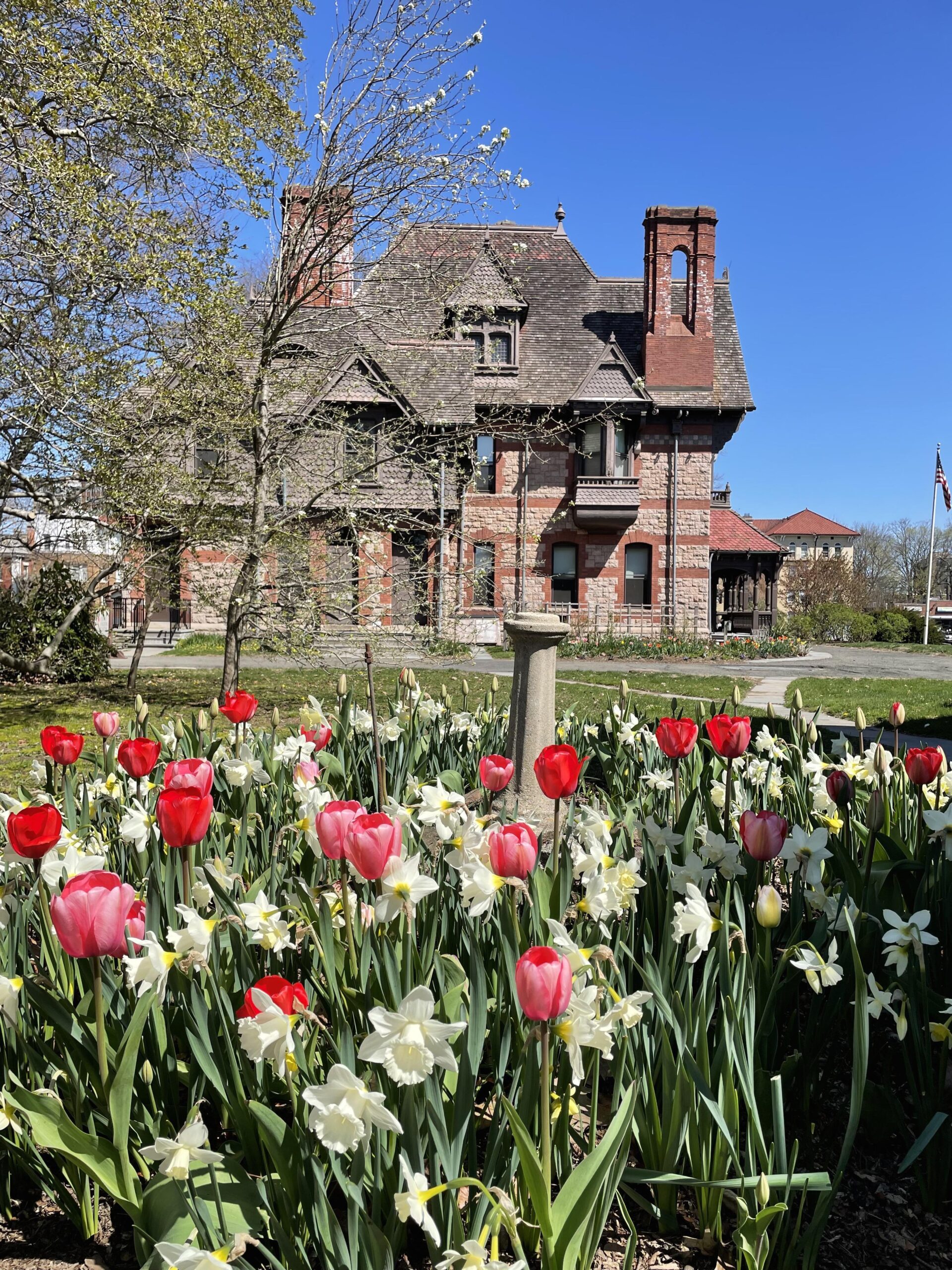 Katharine Seymour Day House with red, pink, and white tulips